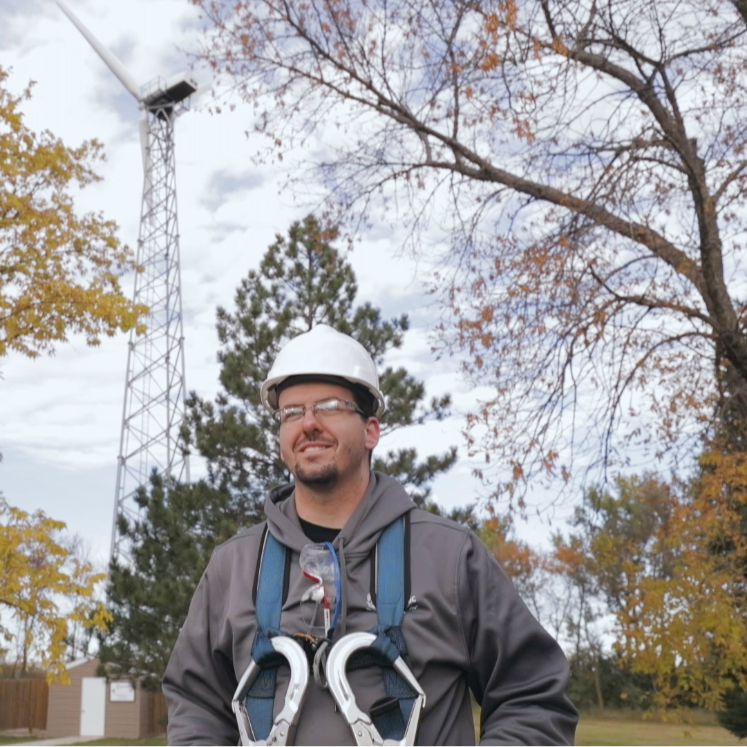 Colby Azevedo prepares to climb the wind tower he is learning to service at Minnesota West Community and Technical Colleg